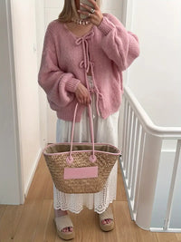 Olinokeia | Schicke Strickjacke in einfarbiger Twist-Optik – Rosa