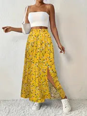 Maria | Floral bedruckter Maxirock mit hochtailliertem Design und Seitenschlitz – Gelb