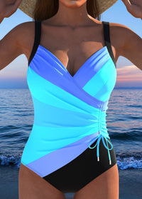 Marie | Eleganter Wickel-Badeanzug mit buntem Print – Blau