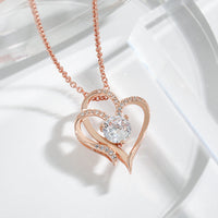 ELENYA – Elegante verstellbare Damen-Halskette mit bezauberndem Doppelherz & funkelnden Zirkonia für einen stilvollen Look – Rosa Gold