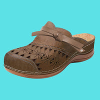 Aerina - Flache, gepolsterte Mules – Braun