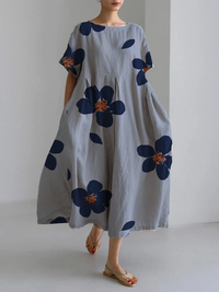 RAFFAELLA | Lang Kleid mit Blumenmuster, lockerer Passform und elegantem Details für schicke Tage – Blau