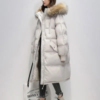Lange Puffer Winterjacke mit Fell – Cremig