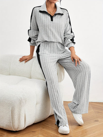 Bequemes Damen-Outfit: Schulterfreier Pullover mit weiter Jogginghose für den Winter