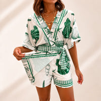 Azzurine™ Skort-Jumpsuit Mit Wickeloptik, Seitlicher Bindung Und Exklusivem Mediterranem Print – Grün