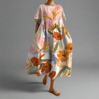 Xyrhilda | Sommerkleid mit Blumenmuster und Fließendem Schnitt – Orange