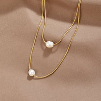 Schichtige Süßwasserperlenkette – 18K Gold