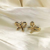 Micara - Bowtiful Delights - Ohrringe – Gold geknotet
