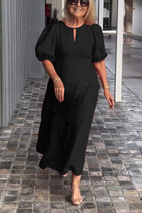 "Natalia | Zeitloses Eleganzkleid" could be rewritten as "Natalia | Klassisches Eleganzkleid". – Schwarz (fast ausverkauft)