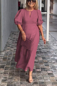 "Natalia | Zeitloses Eleganzkleid" could be rewritten as "Natalia | Klassisches Eleganzkleid". – Dunkelrosa